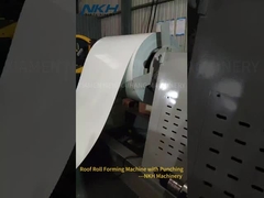 Roof roll forming machine with on line punching
